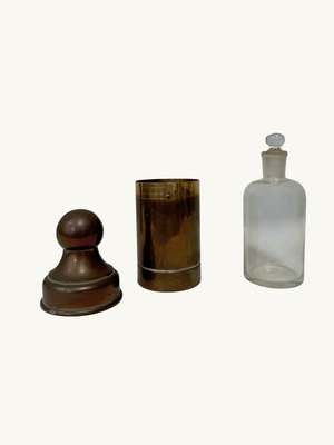 Glass bottle with brass holder