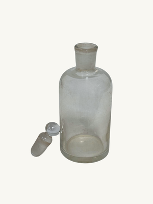 Glass bottle with brass holder