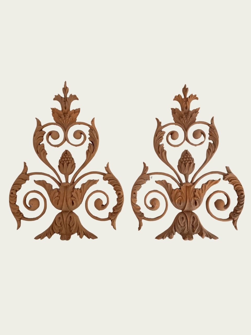 Pair of carved decorations