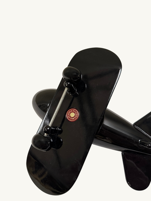 Black toy plane by Playsam Sweden