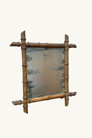 Foxed faux bamboo mirror