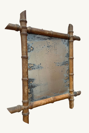 Foxed faux bamboo mirror