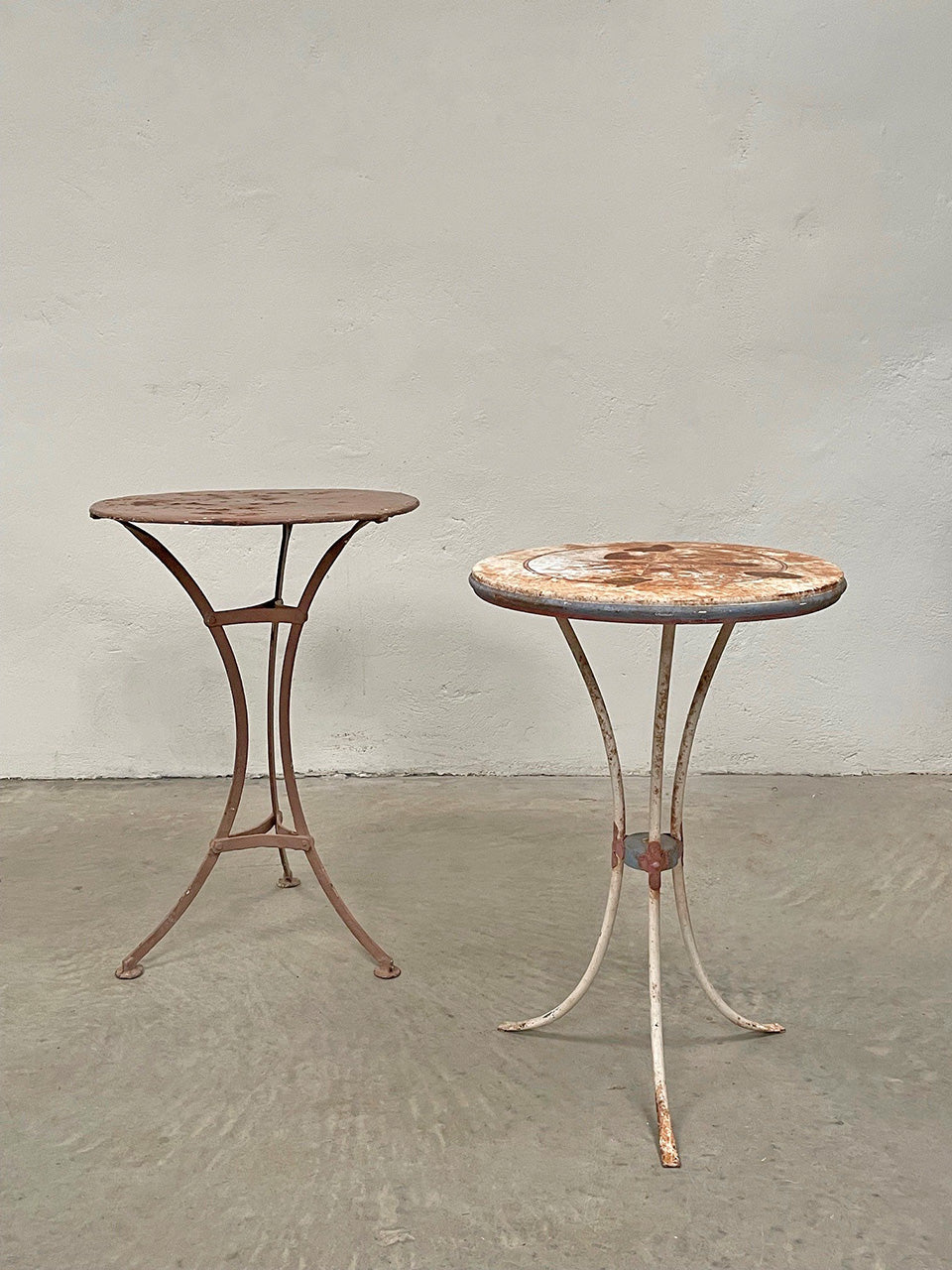 Two metal bistro tables (each)