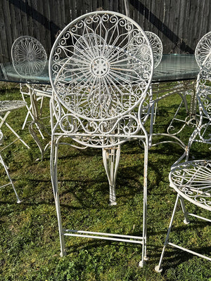 Glass top garden table and 10 chairs (Reserved)