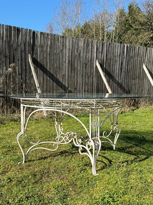 Glass top garden table and 10 chairs (Reserved)