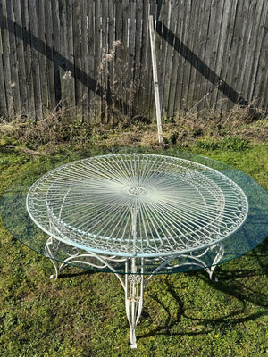 Glass top garden table and 10 chairs (Reserved)