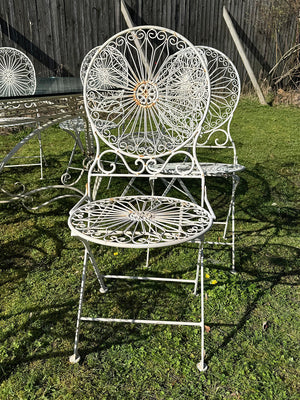 Glass top garden table and 10 chairs (Reserved)