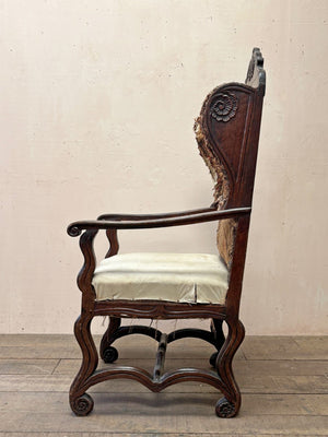 Early oak wing armchair