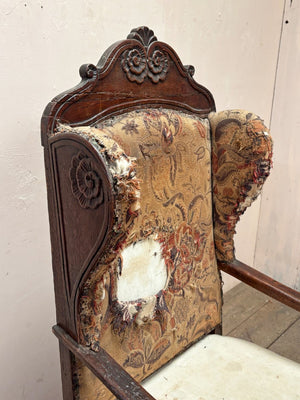Early oak wing armchair