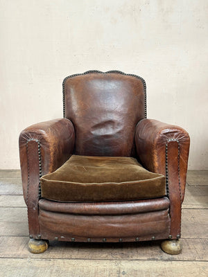 Leather studded club armchairs