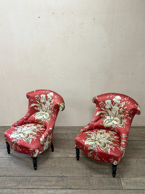 Pair of floral chauffeuse chairs