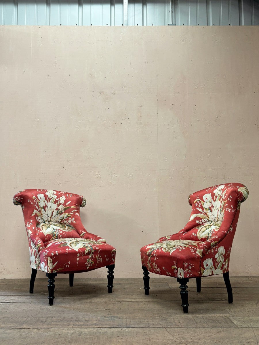 Pair of floral chauffeuse chairs