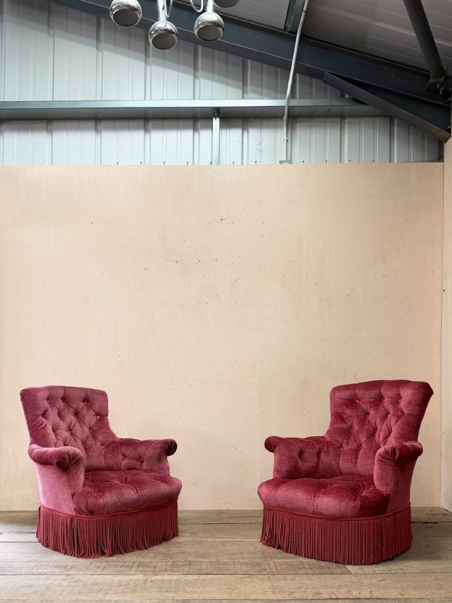 Pair of deep buttoned armchairs