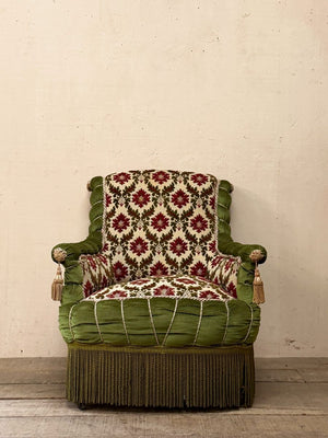 Scroll back armchair with rope edge