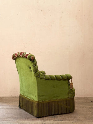 Scroll back armchair with rope edge