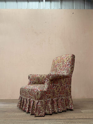 Armchair with skirt