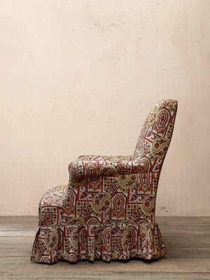 Armchair with skirt