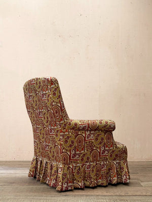 Armchair with skirt