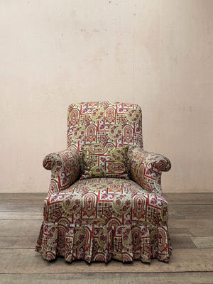 Armchair with skirt