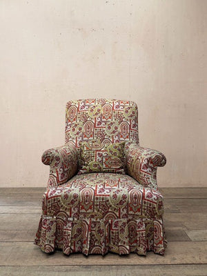 Armchair with skirt