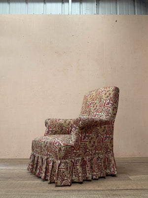 Armchair with skirt