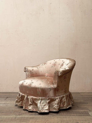 Satin skirted armchair