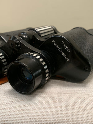 Binoculars with leather case