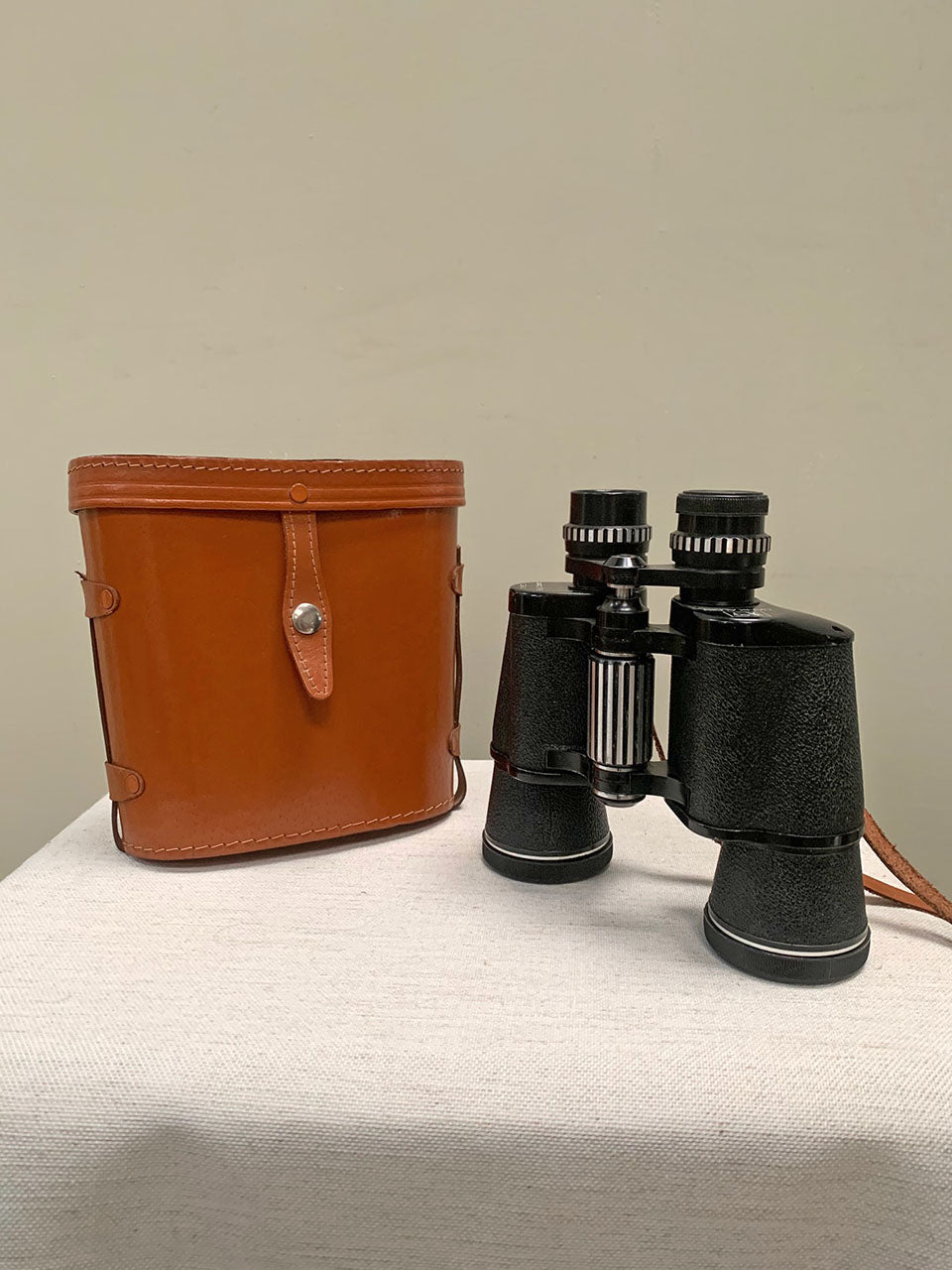 Binoculars with leather case