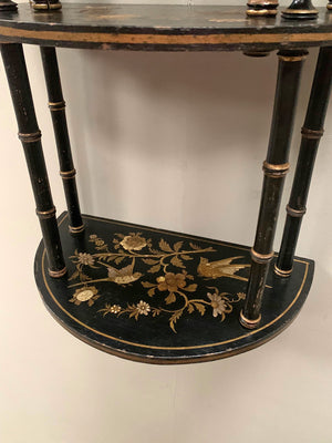 Ebonised and gilded wall shelf