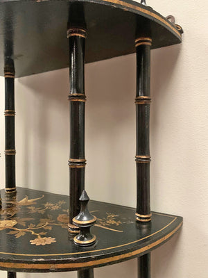 Ebonised and gilded wall shelf