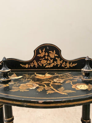 Ebonised and gilded wall shelf