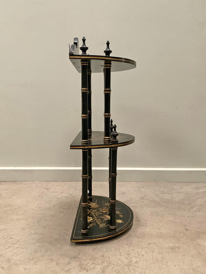 Ebonised and gilded wall shelf