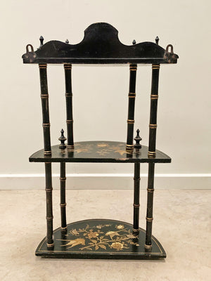 Ebonised and gilded wall shelf