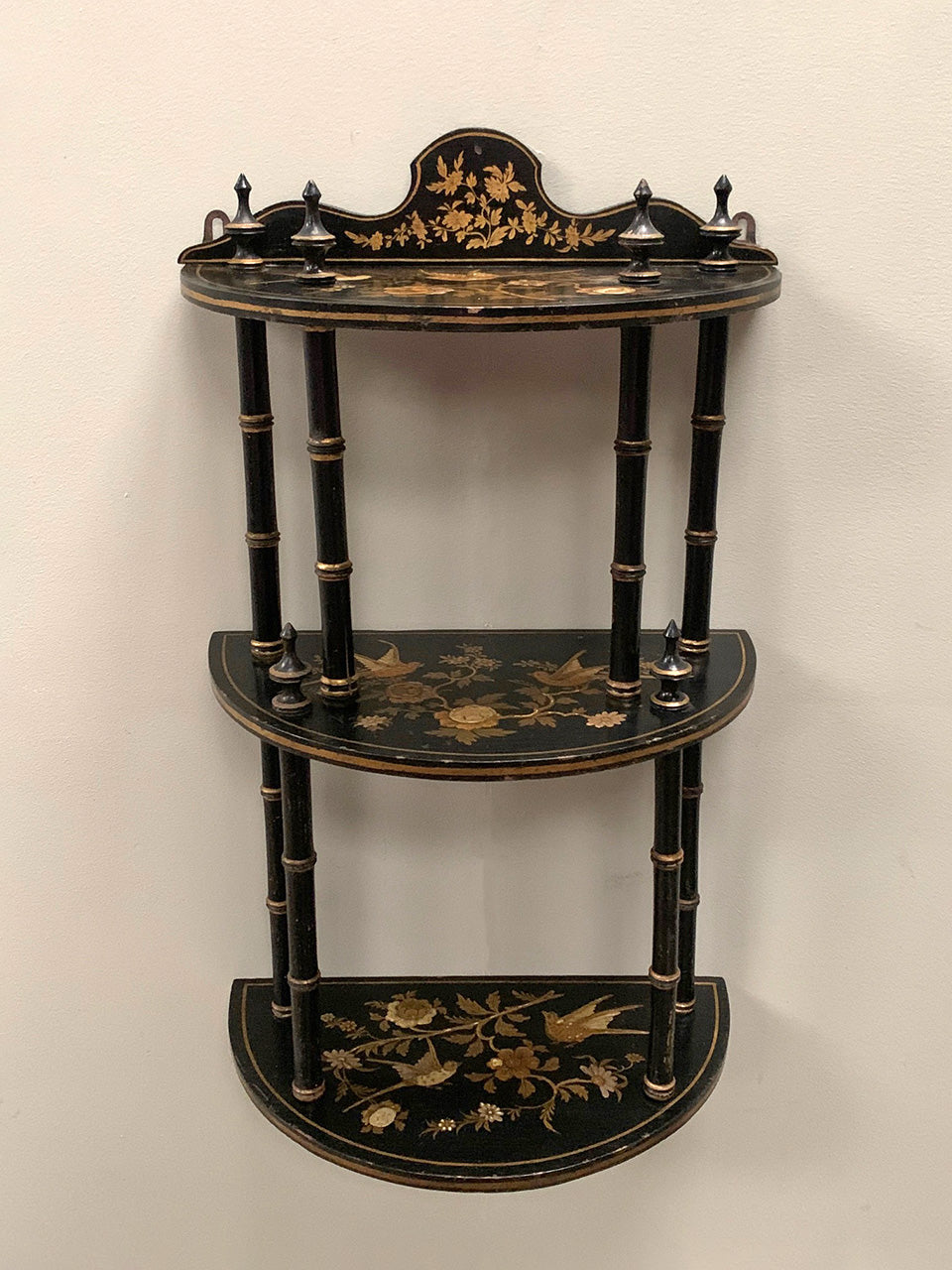 Ebonised and gilded wall shelf