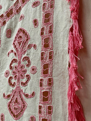 Pink tasseled bedspread