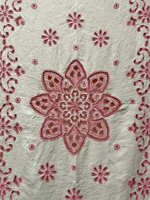 Pink tasseled bedspread