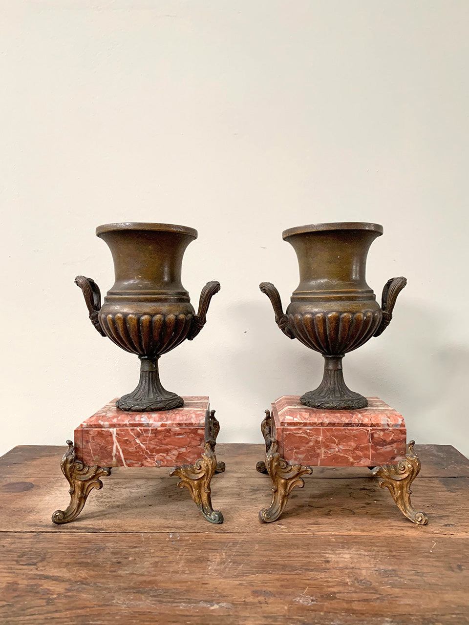 Pair of urns on marble bases