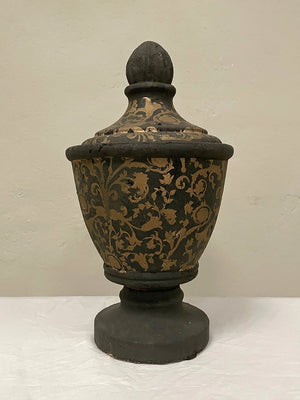 Pair of black and gold painted terracotta urns