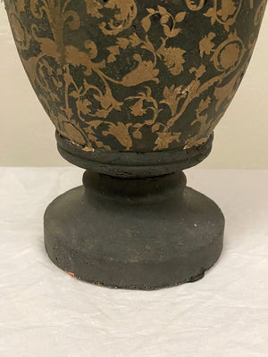 Pair of black and gold painted terracotta urns