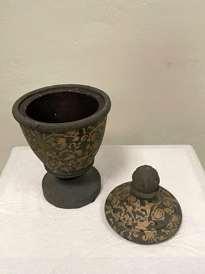 Pair of black and gold painted terracotta urns