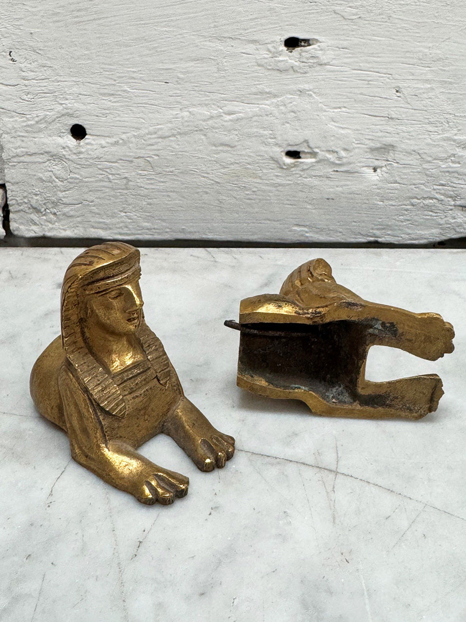 Small pair of brass sphinx decorations