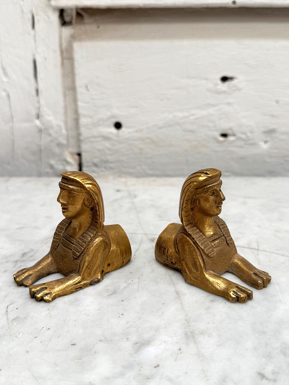 Small pair of brass sphinx decorations