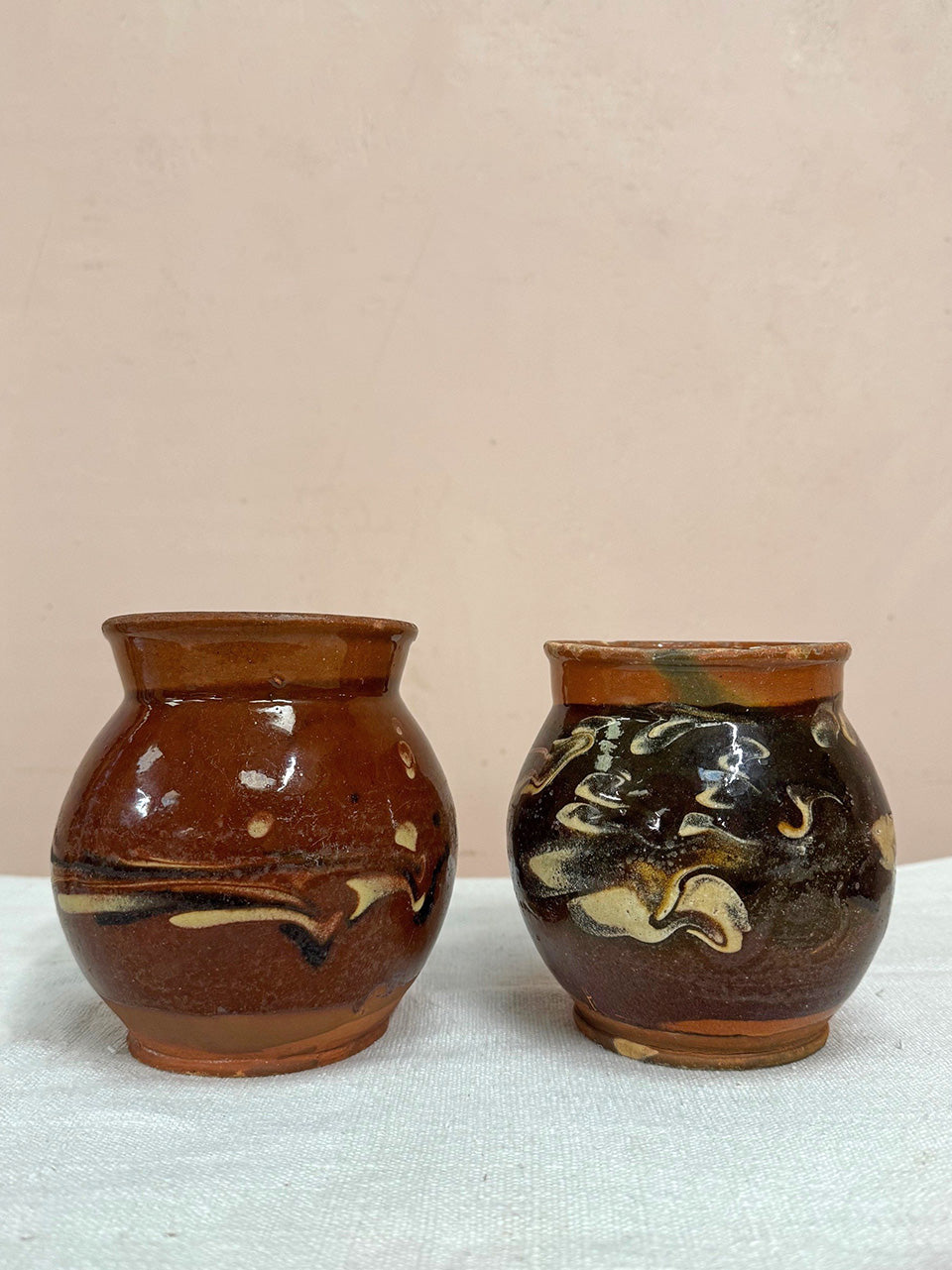 Two terracotta jugs (each)