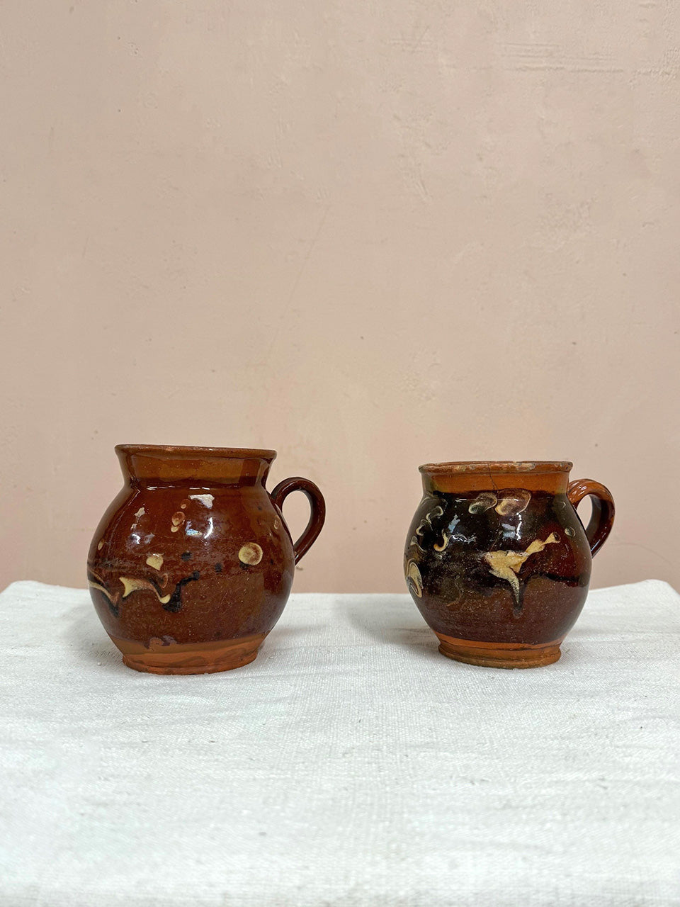 Two terracotta jugs (each)