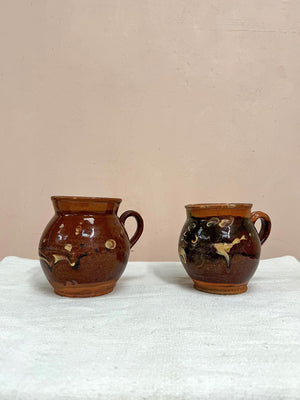 Two terracotta jugs (each)