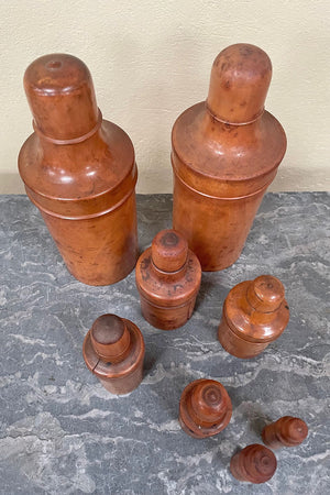 Set of 8 wooden bottle covers