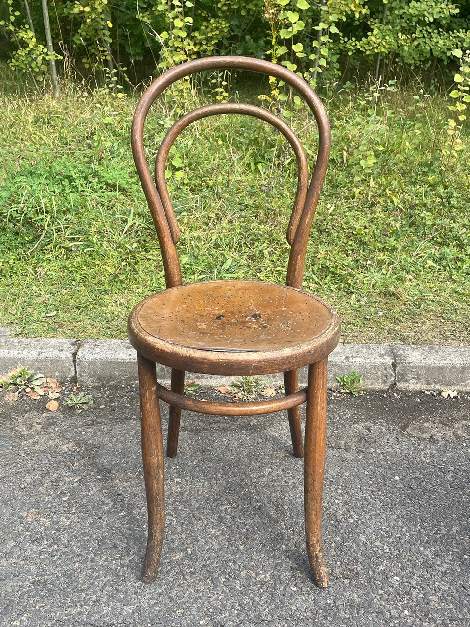 Two bentwood bistro chairs (priced individually)