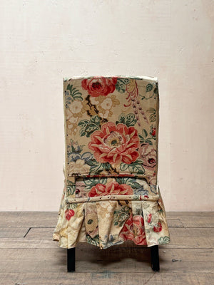 Occasional chair with skirt
