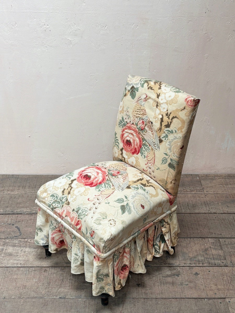 Occasional chair with skirt