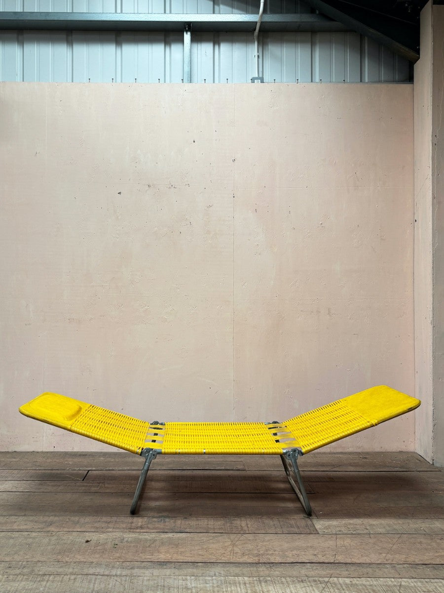 Yellow plastic sun lounger